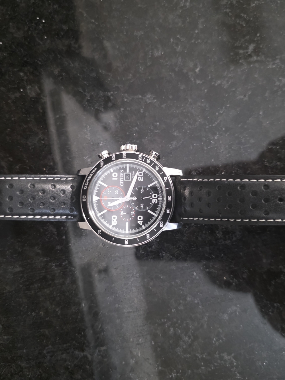 Citizen Eco-Drive Brycen Chronograph, model CA0649-14E. The black dial, red acc